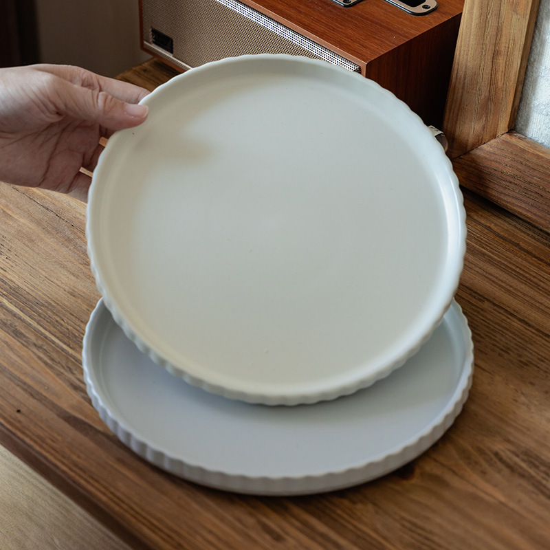 Plato básico de filete de color sólido Plato de cerámica en relieve Plato de cocina casera al por mayor Plato de vajilla de alta calidad Plato de cena occidental