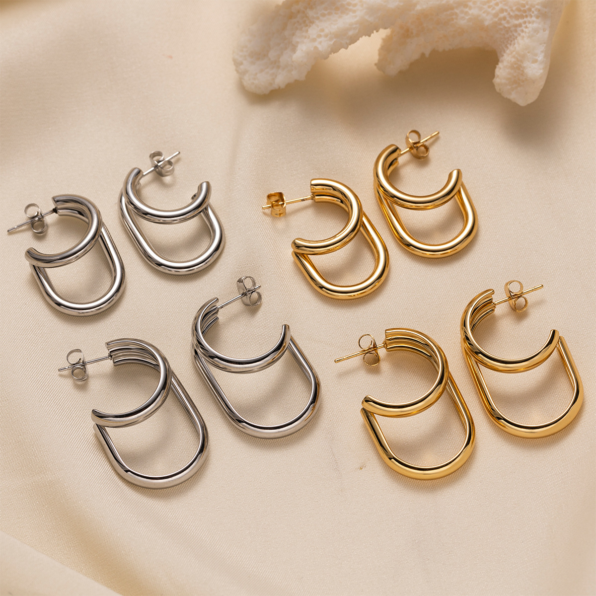 TENA europa y americana de acero inoxidable ligero de lujo de alto nivel galvanizado inductivo 18k oro de forma especial abertura pendientes de acero de titanio vacaciones