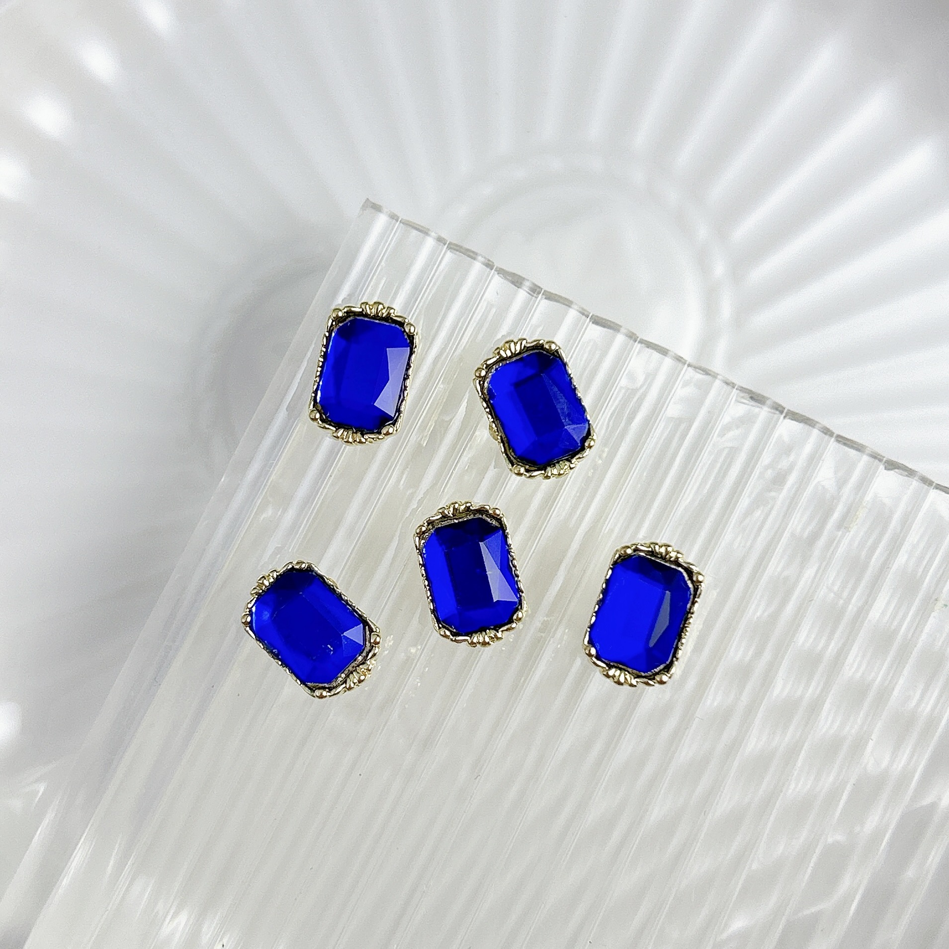 Nueva aleación china joyas de manicura taladro explosión grasa flash Fang amor gota de agua XiFeiYuan la misma armadura de la corte con taladro