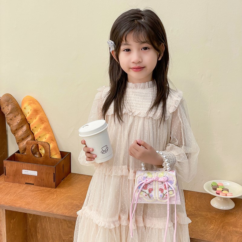 Mochila de moda para niñas, bolso de perla de arco dulce, bolso de mano de 2025 nuevo bolso de cadena para niños