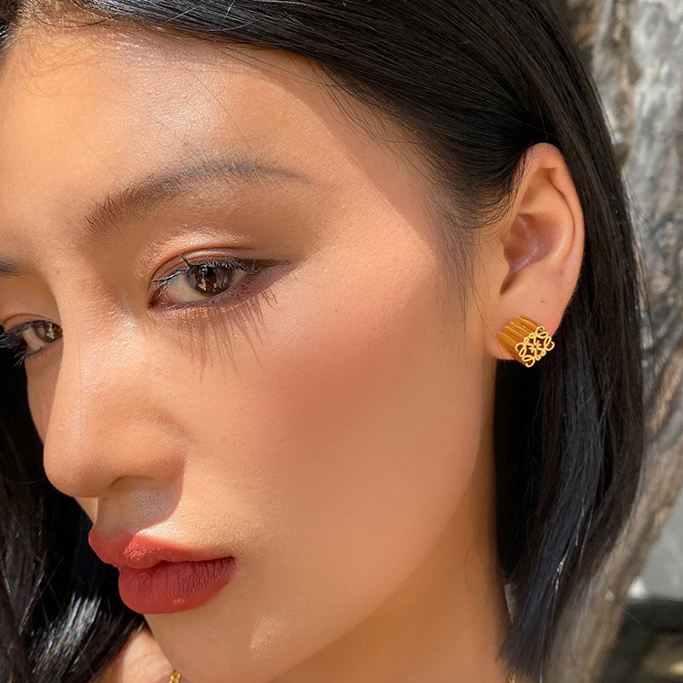 Luo Jia same style brass gold-plated solid stud earrings female temperament light luxury niche design sense high quality European and American earrings batch
