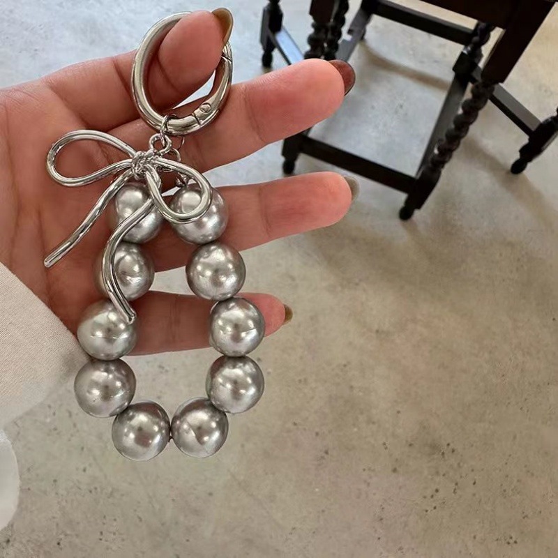 23g Weight Bag Pendant, Keychain Classification 1 Piece Quantity Holiday, Banquet, Travel Occasion Resin Material Bow Knot Pattern Plating Design Casual, Elegant, Lady Style 1 Piece Casual Elegant Lady Bow Knot Resin Plating Bag Pendant Keychain 1