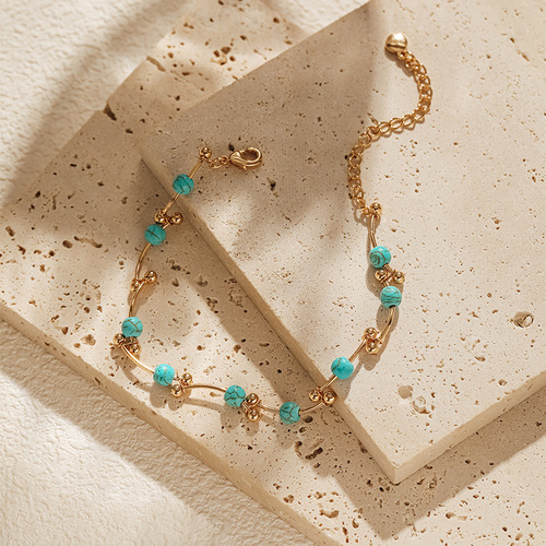 Pearl bracelet with a personalized knotted design, featuring golden round beads and copper tubing—perfect as a lucky charm to attract good fortune, crafted with 18K real gold plating.