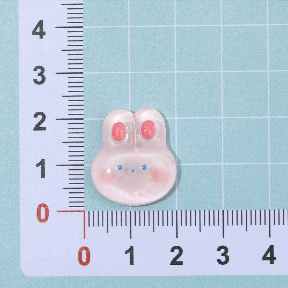 Rosa de dibujos animados conejo congelado DIY accesorios de resina crema pegamento caja del teléfono accesorios para el cabello clip de oído material de parche al por mayor