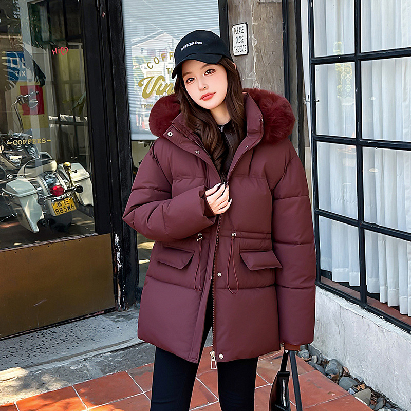 Invierno de 2025 nuevo estilo encapuchado cuello de pelo temperamento cintura retraída chaqueta de algodón de moda suelta chaqueta de algodón gruesa de moda