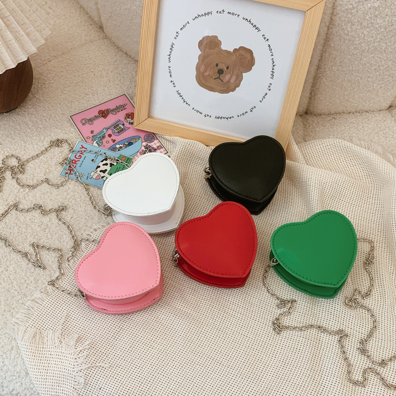 Bolsa de hombro coreana para niños y niñas simple color sólido extranjero amor mochila para niños nueva cadena de comercio exterior bolsas para niños