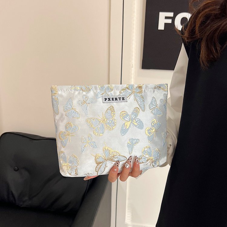 Bolsa de maquillaje de mariposa transfronteriza pequeña bolsa fresca portátil de cuidado de la piel bolsa de almacenamiento bolsa de lavado de viaje bolsa de lona bolsa de mano