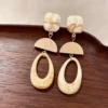 2508134A Beige hollow geometric earrings