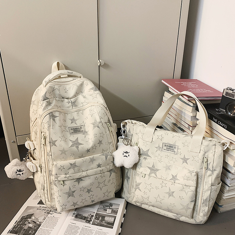 Cross-border 2026 nicho universal estrellas auriculares mochila de gran capacidad mochila de graffiti de viaje de estudiantes universitarios
