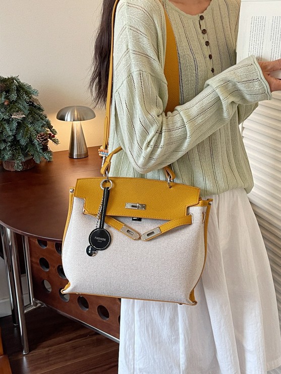 Bolso para mujeres 2026 nuevo cross-border lienzo empalme color contraste bolso de mano alta sensación retro mochila de hombro