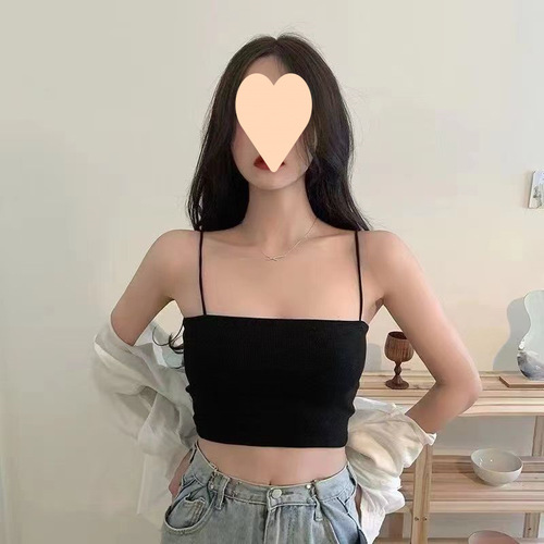 A unique, minimalist women's spaghetti strap vest designed for outerwear, featuring a one-piece, flat neckline, suitable for autumn and winter layering as a chic, stylish base top.