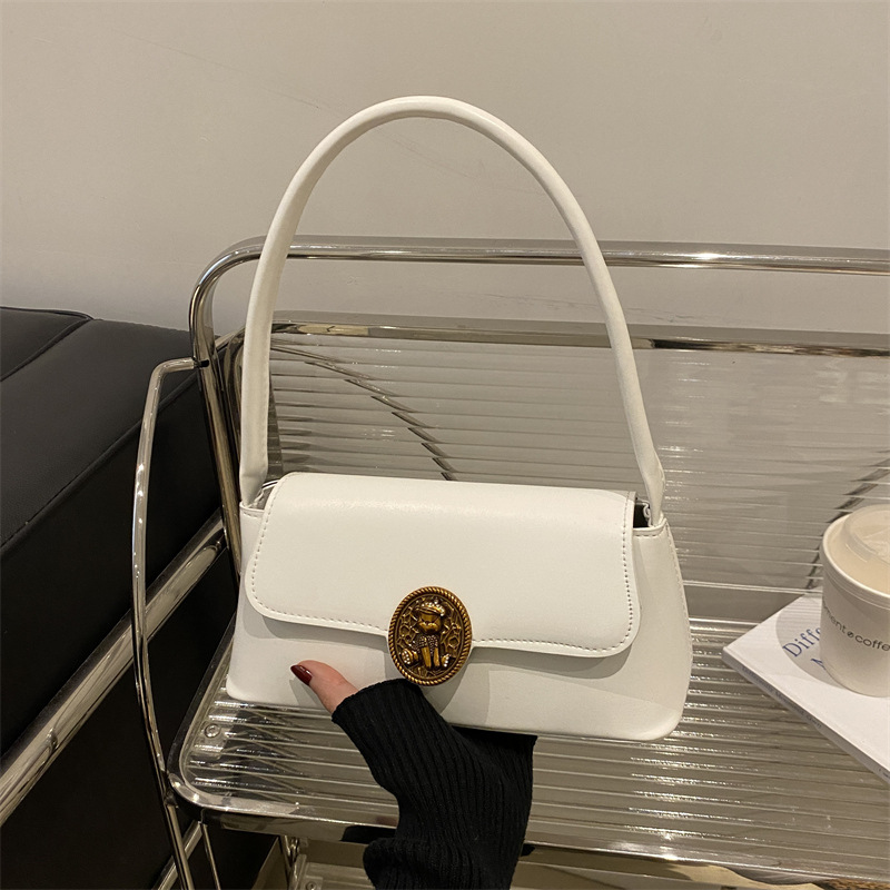 Bolsos retro de estilo extranjero para mujeres otoño y invierno 2024 nueva moda literaria bolsas de brazo de diseño de nicho bolsas de hombro