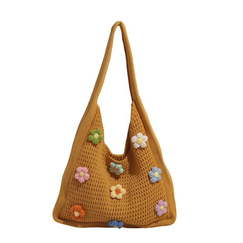 Versión coreana del bolso de nicho 2025 verano nuevo bolso femenino Xuan Yafeng flor bolso de hombro hueco de punto