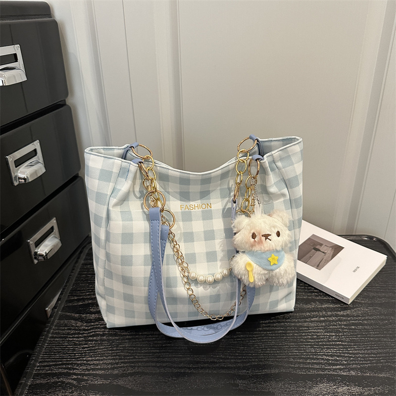 Bolsa de alto valor reticular para mujeres 2026 primavera y verano nuevo paquete de viaje de hombro universal bolso de nicho en línea bolsa de mujer