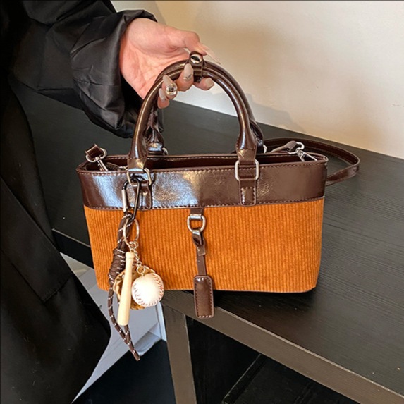 Retro nicho bolso de cubo de color contraste mujer 2025 nuevo otoño invierno versátil bolso de hombro de moda bolso de mano