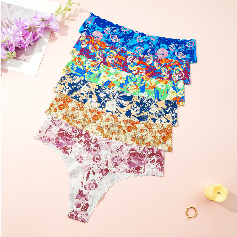 Europa y los Estados Unidos invisibles ondulados impresión sin marcas en forma de T pantalones transpirables de cintura baja deportivo sexy thongs mujeres