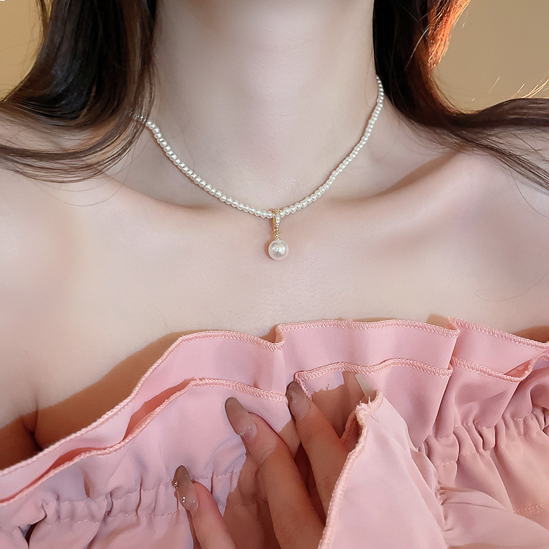 Collar de perlas con lazo de flor con cuentas francesas Elegante cadena de clavícula con sentido de alta gama retro ligero decoración de lujo femenino