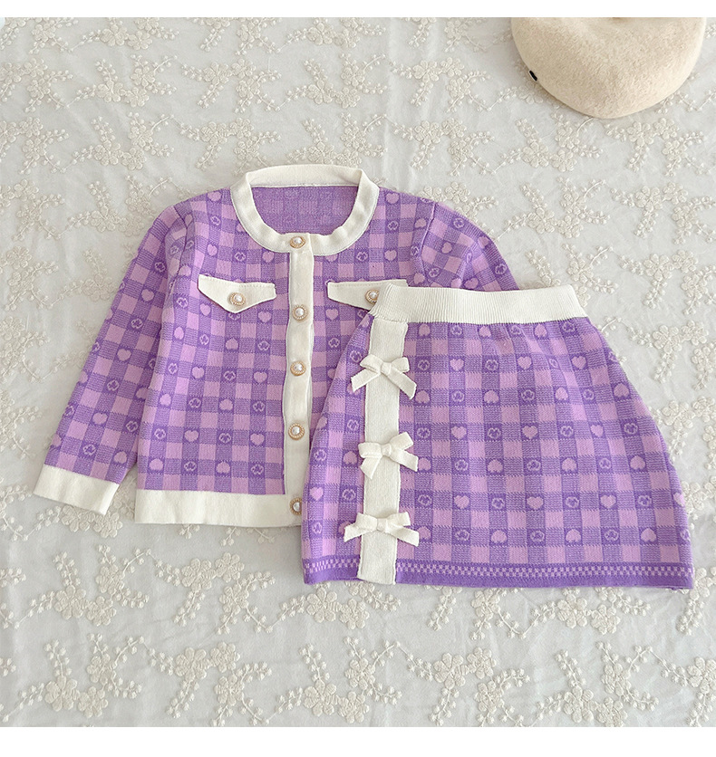 JINYONG Koreansk utgåva Love Knitwear Flickkjol med rosett och omlott, liten och medelstor, barnmodell, tvådelat set_voghion.com