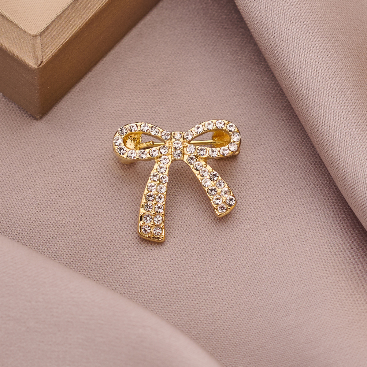 brooch with bow