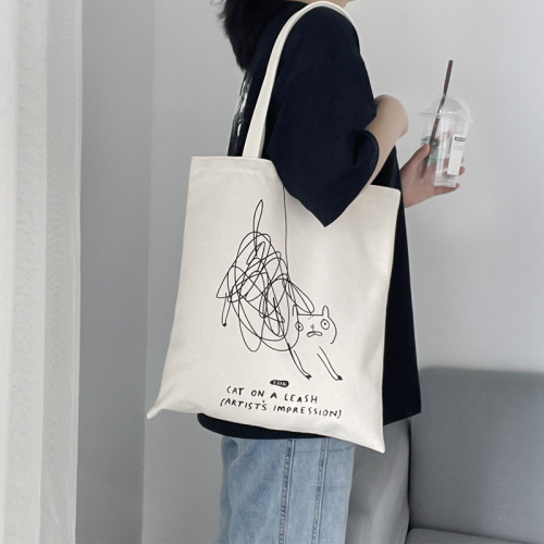 Niche personality graffiti design cute cat one-shoulder canvas bag women's summer portable commuting bag