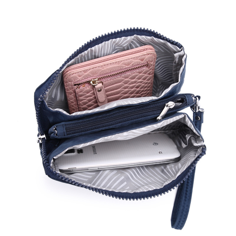 Bolsa de mano de nylon multicapa de gran capacidad a prueba de derrames de agua de mujer simple de moda larga cremallera cambio pasaporte bolso móvil