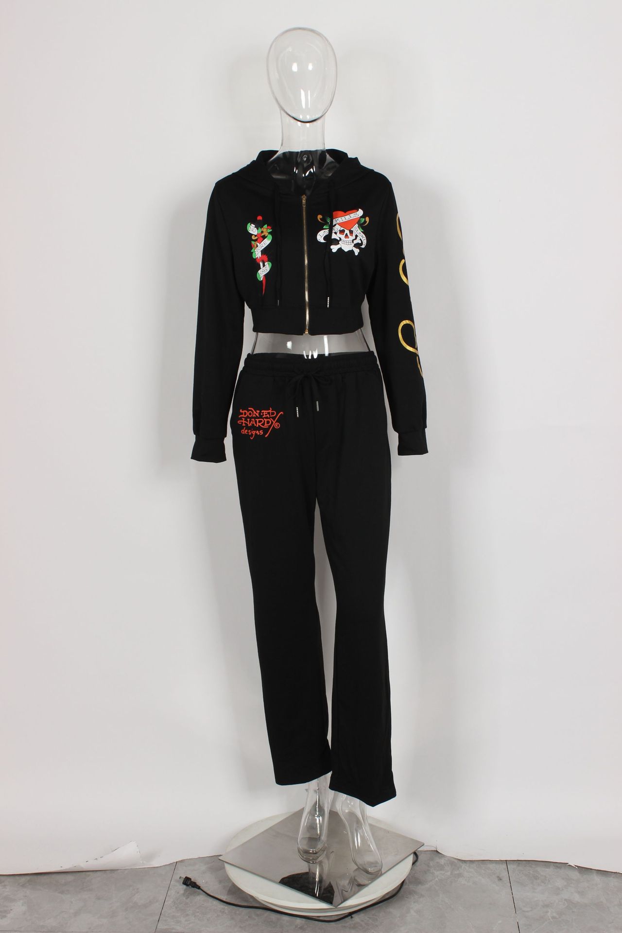 Conjunto de dos piezas para mujer, cárdigan corto básico con cremallera y estampado de calavera y corazón de Brand Street, pantalones rectos de cintura alta