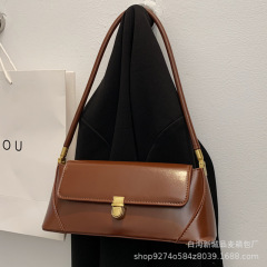 フランス式の大衆通勤バッグファッション2025新型百合女性バッグファッション高級質感シングル肩脇下法棒バッグ