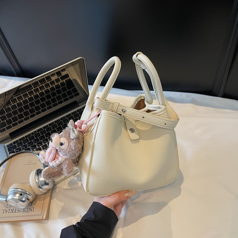 Venta caliente de comercio exterior bolso de cubo de verano mujer 2025 bolso de canasta de verduras de mano nueva tendencia bolso de mensajero de alta gama de todos los partidos