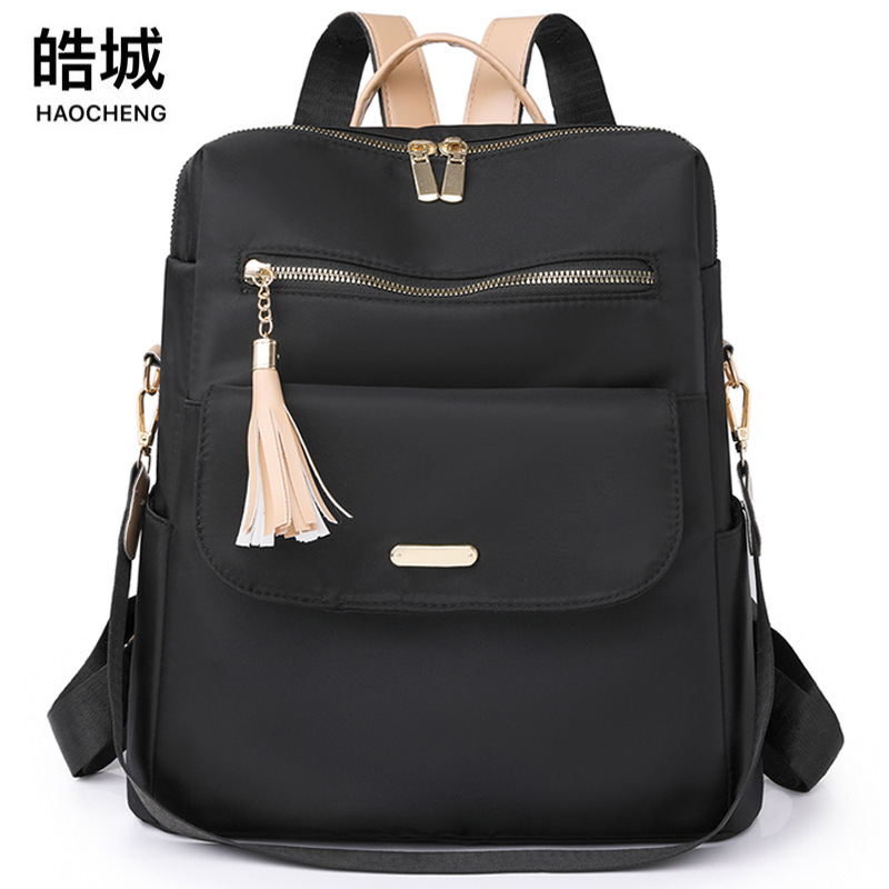 Bolso mujer 2023 nueva mochila casual para mujer con borla de nailon simple color de contraste mochila ligera multifuncional marea