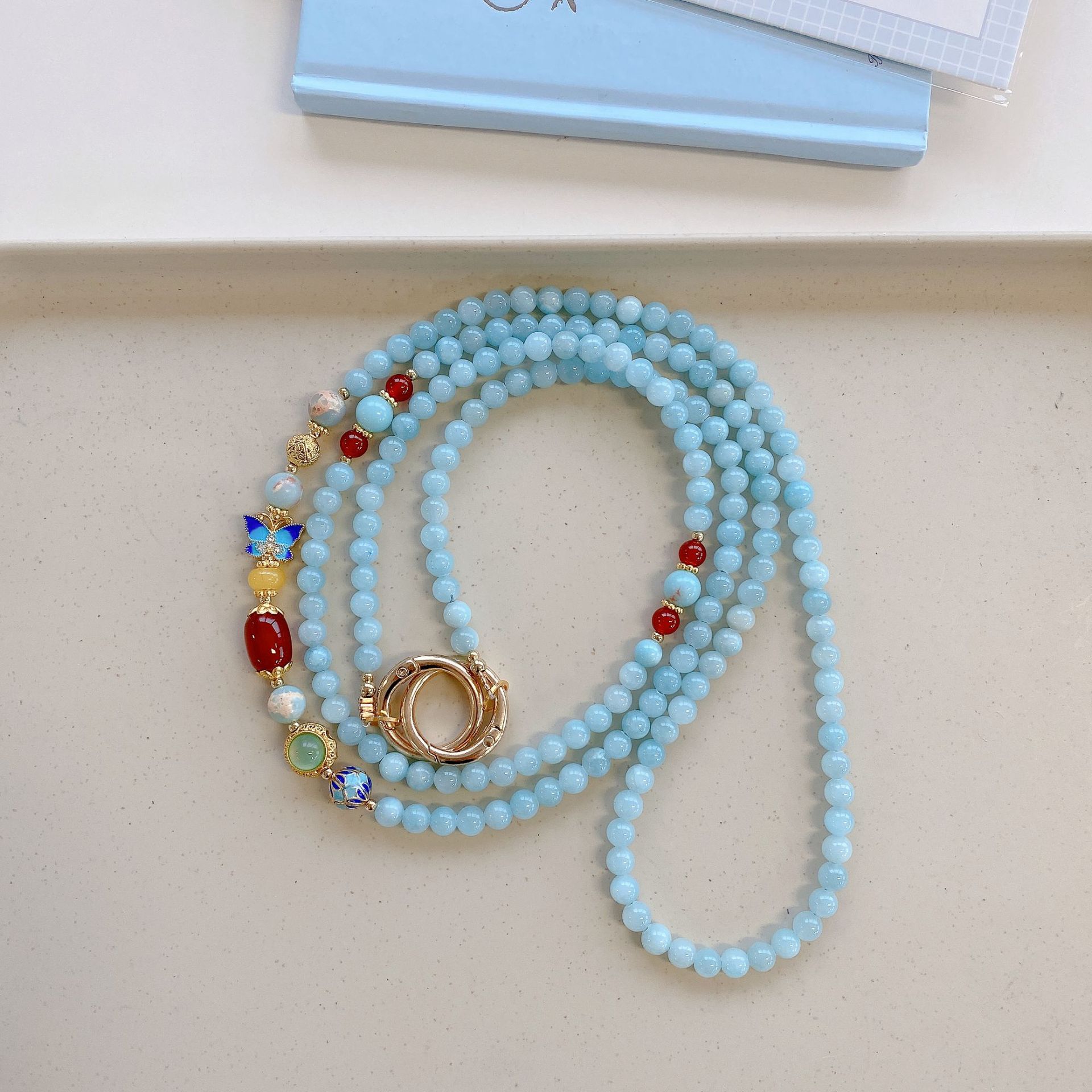 Boutique hecho a mano de alta gama para teléfono móvil cadena larga de ágata cloisonné femenina cordón de teléfono móvil de moda colgante de mensajero largo