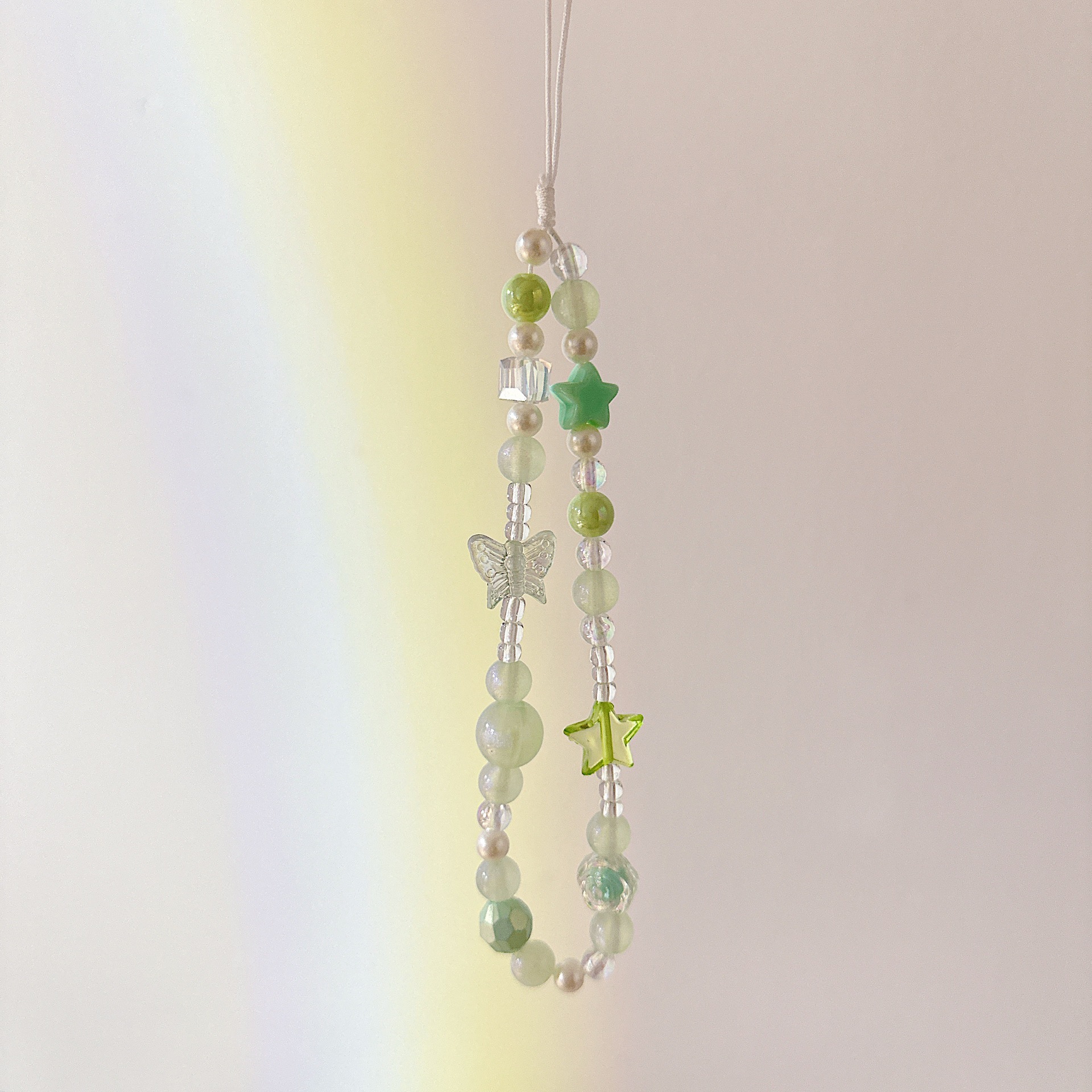 Cadena aplicable nicho mariposa corta cadena de muñeca arco cuentas de caso de teléfono móvil colgante tipo correa de muñeca anti-pérdida