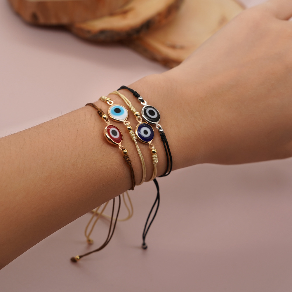 Pulseira de berloques olho grego com contas douradas_voghion.com