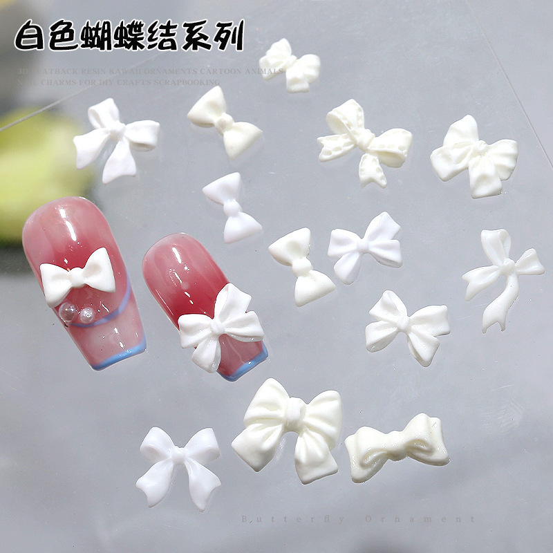 Net red explosion white bow nail jewelry simple three-dimensional sweet ribbon resin nail accessories diamond wholesale Net red explosion white bow nail jewelry simple three-dimensional sweet ribbon resin nail accessories diamond wholesale