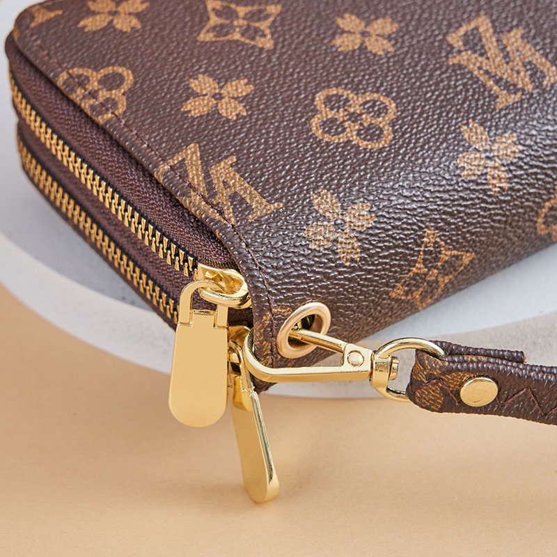 Cartera larga para mujer nueva 2025 popular europea y americana de gran capacidad con doble cremallera bolso para teléfono móvil bolso de mano con letras impresas
