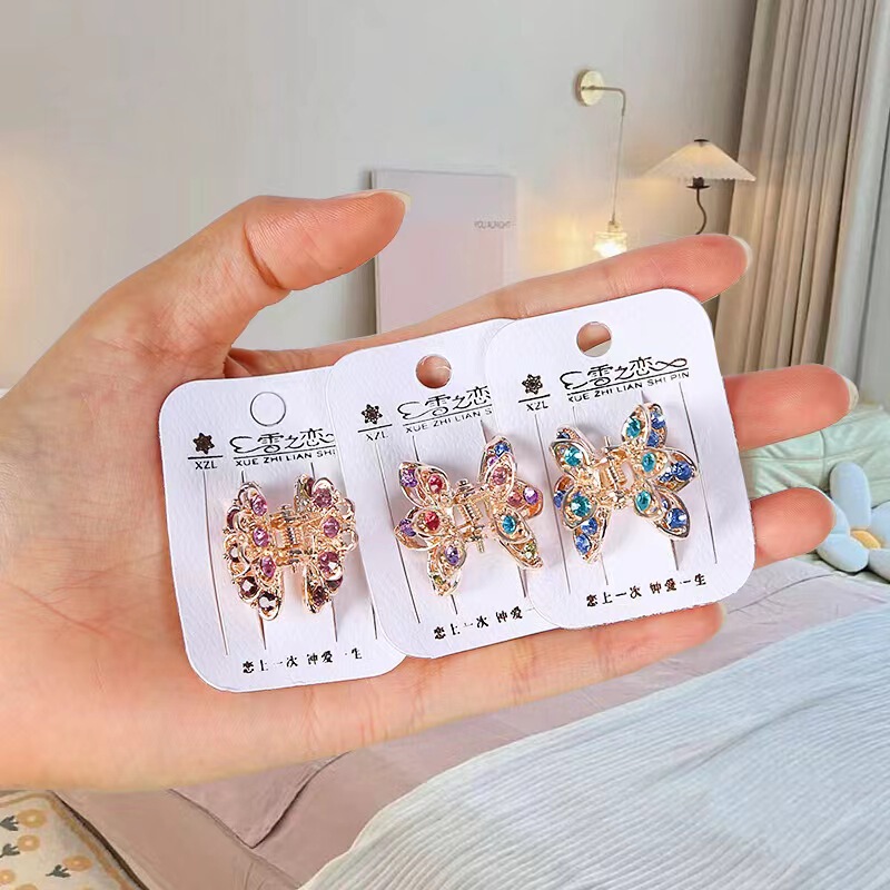 Yiwu manufacturers wholesale jewelry new claw metal Korean Rhinestone Cat's Eye grip alloy medium grip