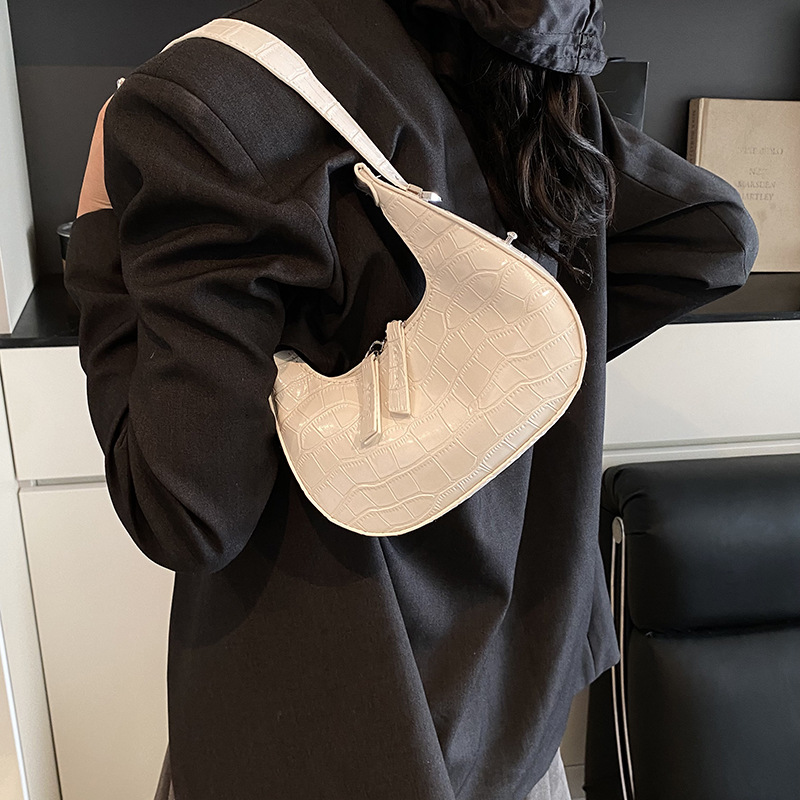 Bolso de axila con textura transfronteriza 2025 primavera nuevo bolso femenino bolso retro con patrón de piedra bolso de hombro brillante de charol