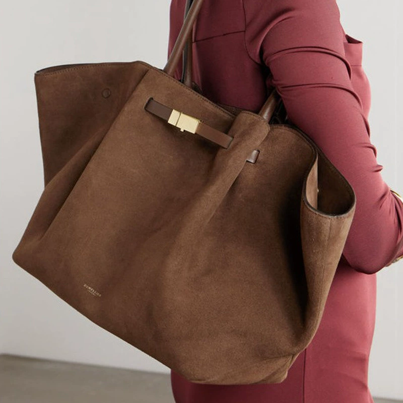 Handheld capacious purse, shoulder bag