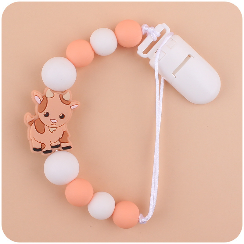 Nuevo bebé suministros chupete cadena creativa de dibujos animados Cordero silicona bebé mordedura cadena anti-gota molar