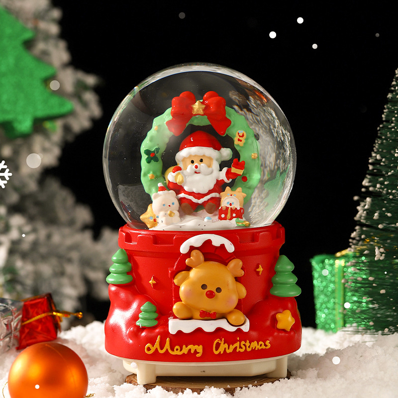 Una variedad de regalos de decoración de Navidad Navidad iluminante bola de cristal caja de música ventana diseño de velas lámparas de viento árbol de Navidad
