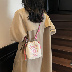 女子学生の水を防ぐキャンディー色のショルダーバッグ2025春の新型ドーナツプリントの軽やかなファッションの鍵バッグ