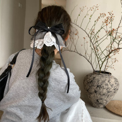 韓国レースのスカートの蝶結びの低い馬尾のヘアピン2025の新型のフランスの甘い心の王女の半髪の飾りの女性