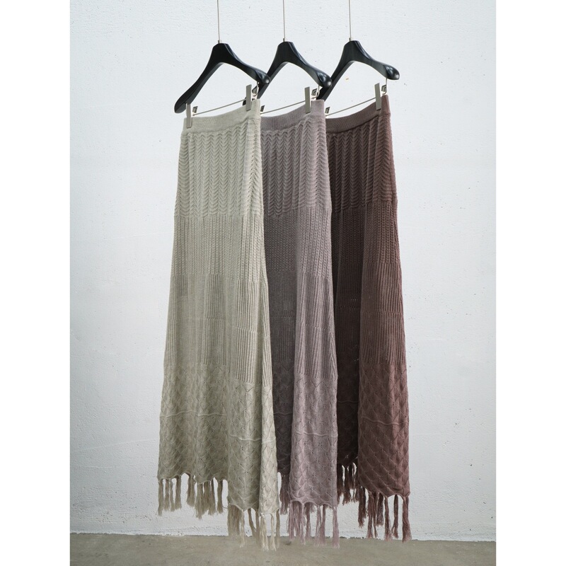 Atmospheric bohemian-style fringed knit long dress with hollow-out patterns, long A-line skirt, and a relaxed, floor-length design