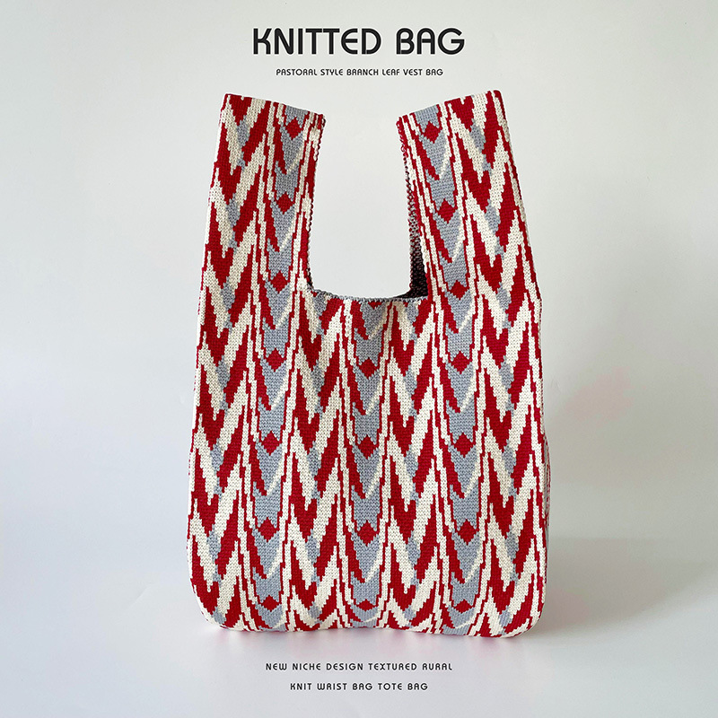 Bolsa de diseño de nicho de punto bolso de hombro bolso de mano simple de gama alta todo-fósforo de gran capacidad estudiante bolso de la muñeca