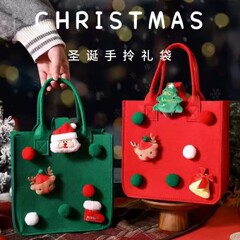 赤い本を卸売りしてクリスマスのプレゼント袋のクリスマスイブのリンゴ袋のキャンディー袋の漫画のフェルトの手提げ袋を包みます。
