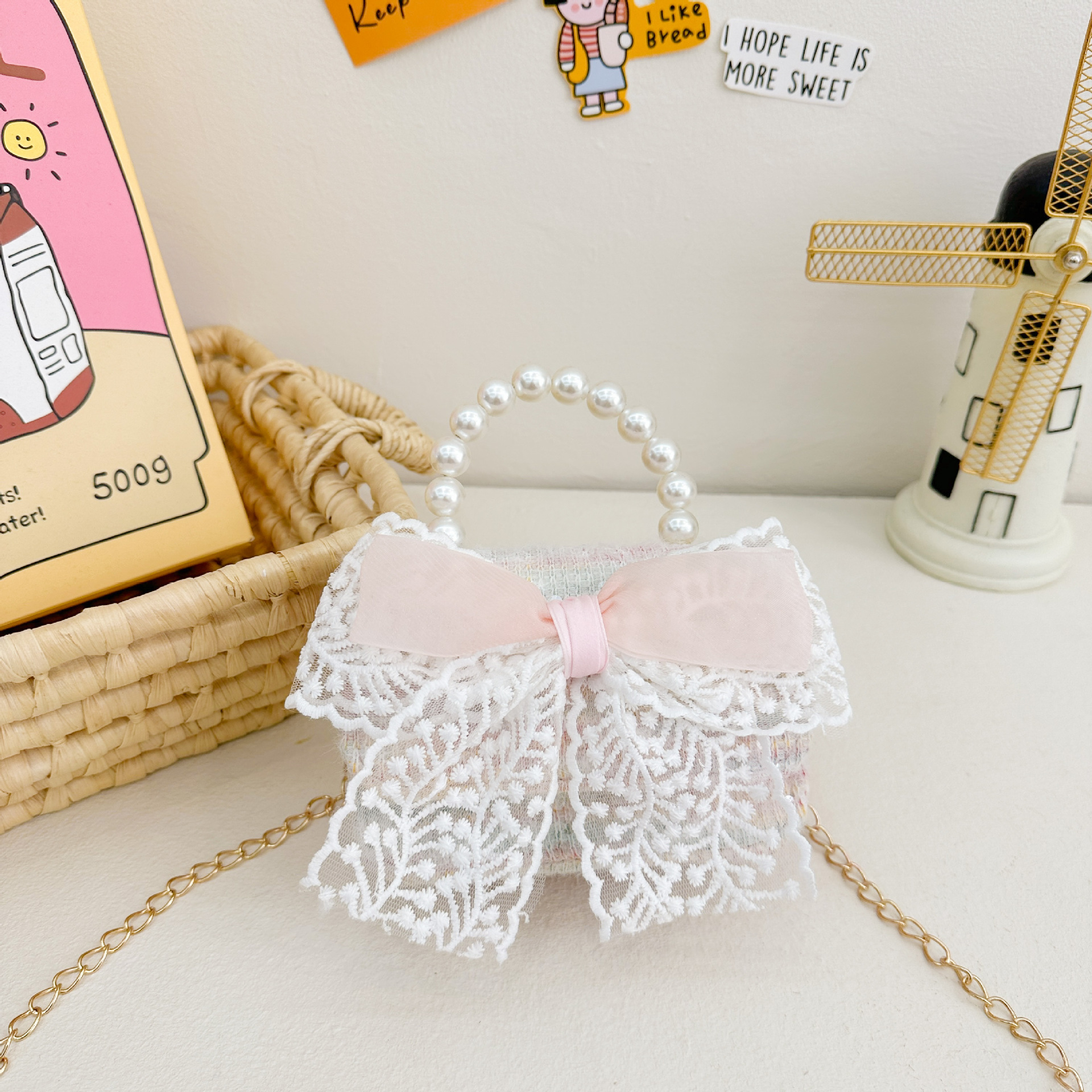 Nuevo bolso infantil de moda de otoño bolso de mochila para chicas bolso portátil de perlas princesa pequeña fragancia bolso de cambio al por mayor