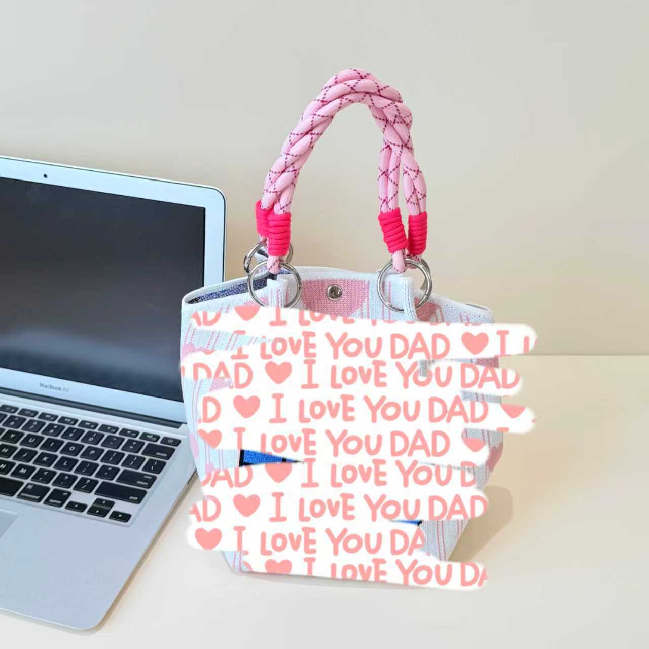 2026 primavera y verano nuevo bolso de cubo de pintura creativo portátil gran espacio de aire de dopamina alta sensación mochila
