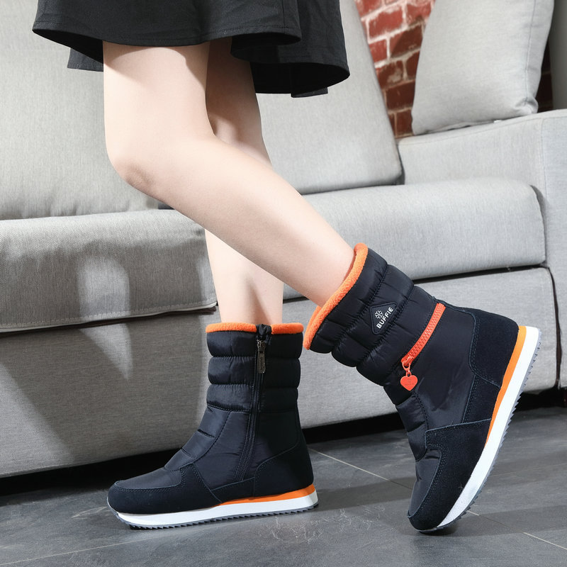 Botas de nieve de las mujeres de fondo plano a media pantorrilla impermeable cremallera engrosada zapatos de algodón transfronterizo Taobao suministro al por mayor entrega de una sola pieza