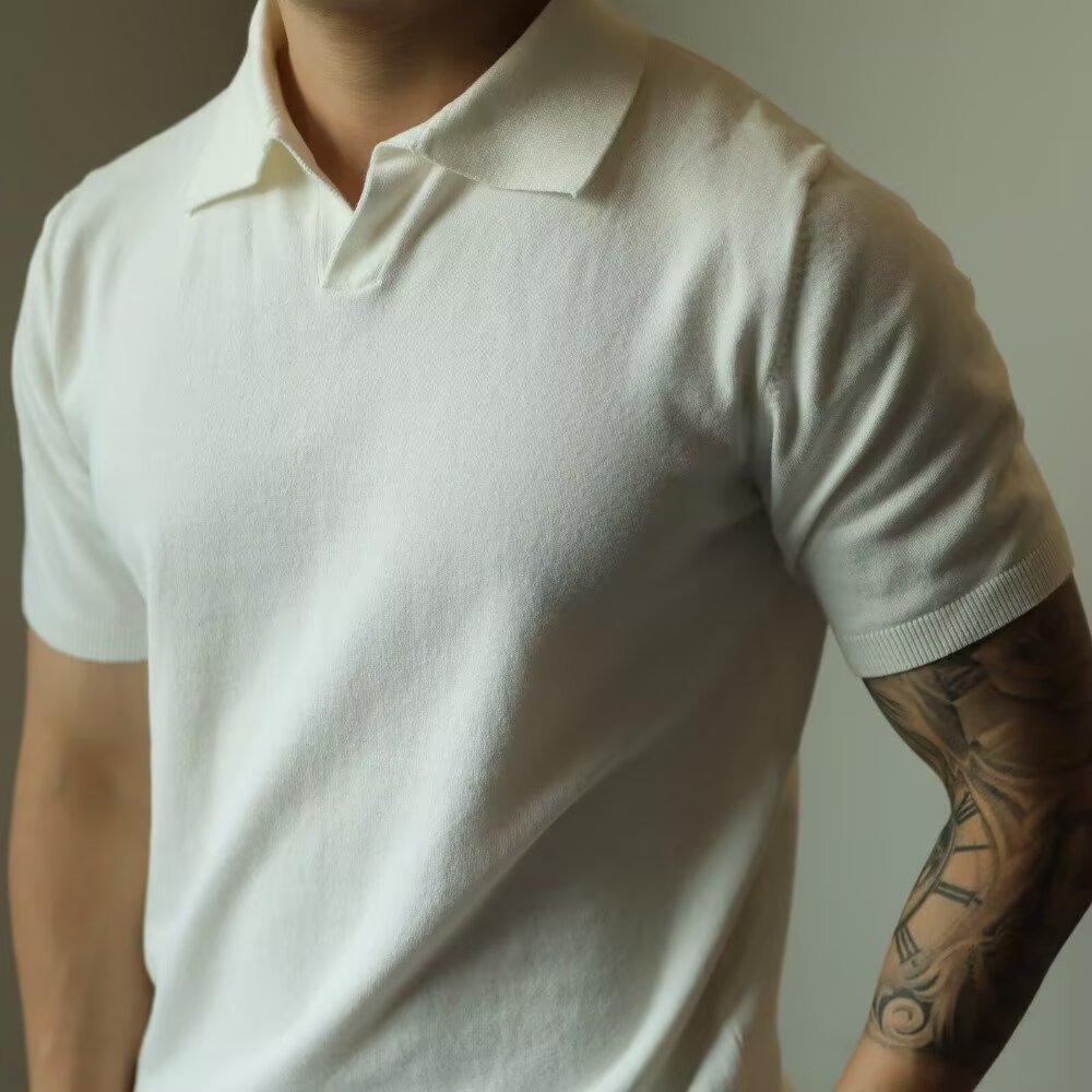 Camisa de polo con cuello en V americano, suéter de punto para hombre, camiseta de manga corta, solapa informal suelta, moda de color sólido, blusa de verano