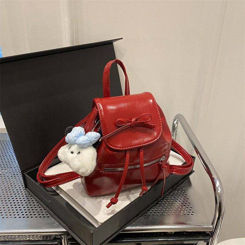 Mochila de nicho coreana para mujer, verano 2024, nueva mochila de moda, bolso de cubo portátil de un solo hombro de todo fósforo