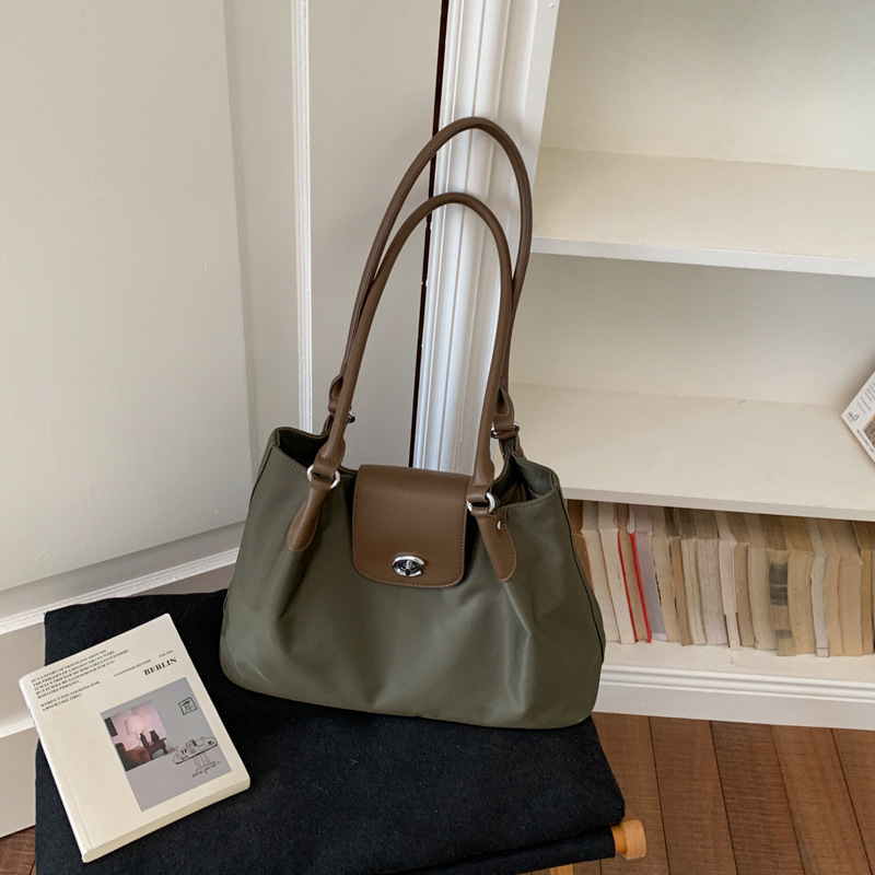 Bolsa de alta calidad de gran capacidad para mujeres 2026 verano nuevo estilo ligero simple hombro brazaleta de viaje bolsa de ocio image 9
